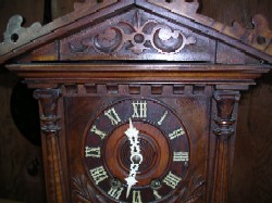 Black Forest trumpeter clock, Front upper case.